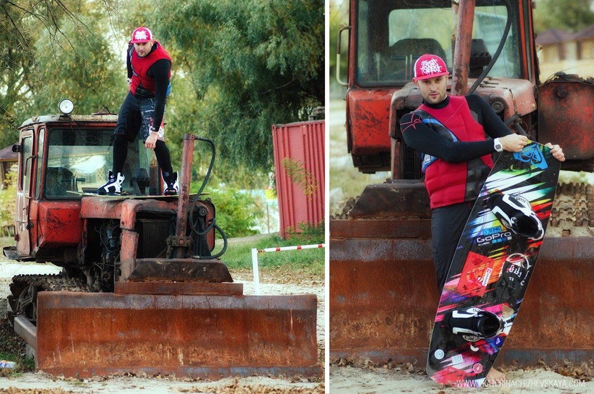 A split photo of a wakeboarder wearing a pink cap; on the left, he is standing on top of an old red rusty tractor, and on the right, he is standing next to it holding his wakeboard.